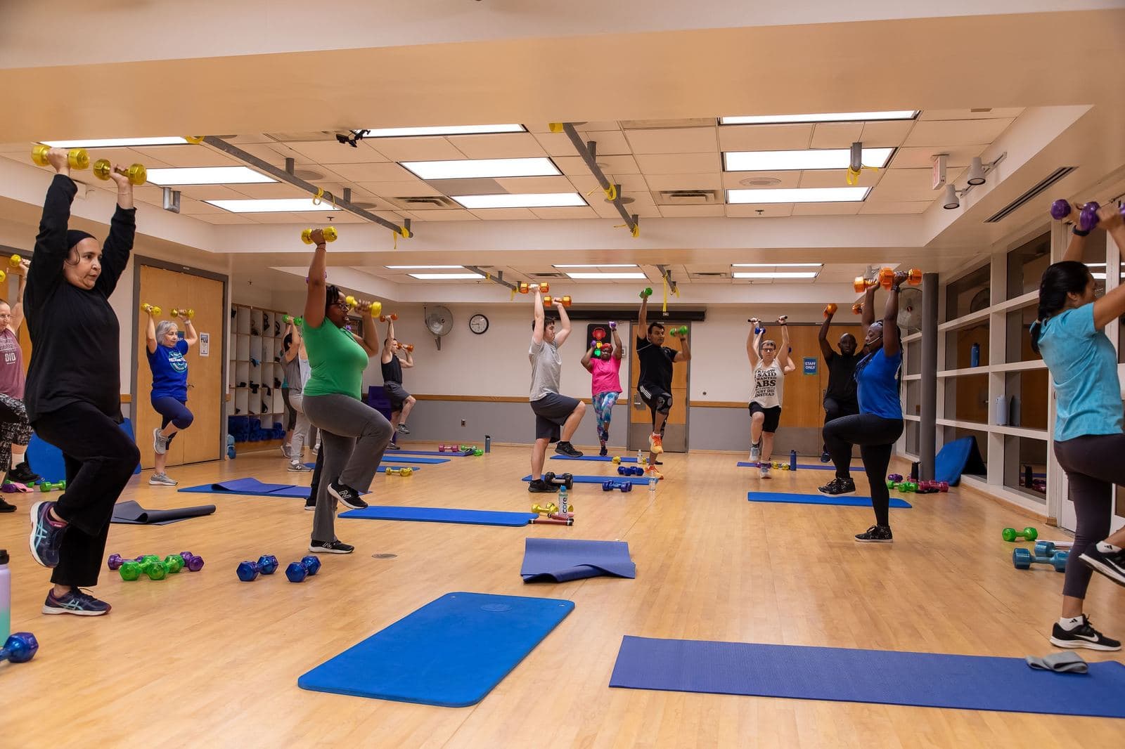 Members stretching in a group class